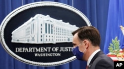 File- Acting Assistant Attorney General Brian Rabbitt spoke at the Justice Department, Oct. 22, 2020, after a subsidiary of Goldman Sachs agreed to pay more than $2 billion in a foreign corruption probe tied to the Malaysian 1MDB sovereign wealth fund.