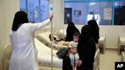 FILE - People are treated for suspected cholera infections at a hospital in Sanaa, Yemen, Jul. 1, 2017. 