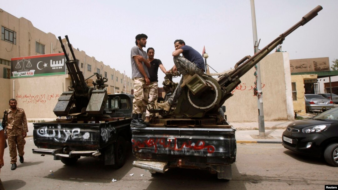 Libyan militias blockade the Justice Ministry in Tripoli April 30 demanding the ouster of officials linked to the late Moammar Gadhafi.