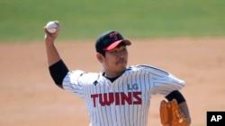 Letters reading "Corona 19 Out" is seen on the cap of LG Twins baseball team's pitcher Jeong Chan-heon as a part of campaign to overcome the coronavirus during an intrasquad baseball game in Seoul, South Korea, April 5, 2020. 