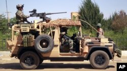 French special forces drive through the city of Gao, Northern Mali, Jan. 30, 2013. 