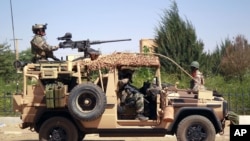 French special forces drive through the city of Gao, Northern Mali, Jan. 30, 2013.