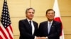 U.S. Secretary of State Antony Blinken, left, shakes hands with Japanese Prime Minister Shigeru Ishiba at Ishiba's office in Tokyo, Jan. 7, 2025.