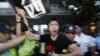 Hong Kong Police Scuffle with Hu Protesters