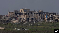 Destroyed buildings by Israeli bombardments in the northern Gaza Strip as seen from southern Israel, March 5, 2025.