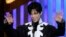 Prince accepts the award for Outstanding Male Artist at the 38th NAACP Image Awards, March 2, 2007, in Los Angeles. 