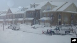 Snow removal crews plowing streets in Washington, DC suburb of Lorton, VA, 8 Feb. 2010