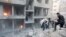 Men search for survivors at a site activists said was hit by heavy shelling by forces loyal to Syria's President Bashar al-Assad in the Douma neighborhood of Damascus June 16, 2015.