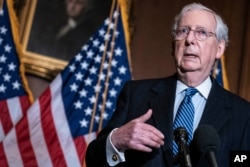 FILE - Senate Republican Majority Leader Mitch McConnell speaks during a news conference at the Capitol, Dec. 8. 2020.