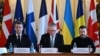 French President Emmanuel Macron, British Prime Minister Keir Starmer and Ukrainian President Volodymyr Zelenskyy prepare to hold a plenary meeting at a summit held at Lancaster House in central London on March 2, 2025.