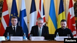 French President Emmanuel Macron, British Prime Minister Keir Starmer and Ukrainian President Volodymyr Zelenskyy prepare to hold a plenary meeting at a summit held at Lancaster House in central London on March 2, 2025.