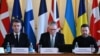 France's President Emmanuel Macron, Britain's Prime Minister Keir Starmer and Ukraine's President Volodymyr Zelenskyy prepare to hold a plenary meeting at a summit held at Lancaster House in central London on March 2, 2025. 