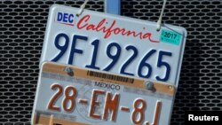 A transport truck displaying California and Mexico license plates is parked on a street in Otay Mesa, California, Jan. 27, 2017.