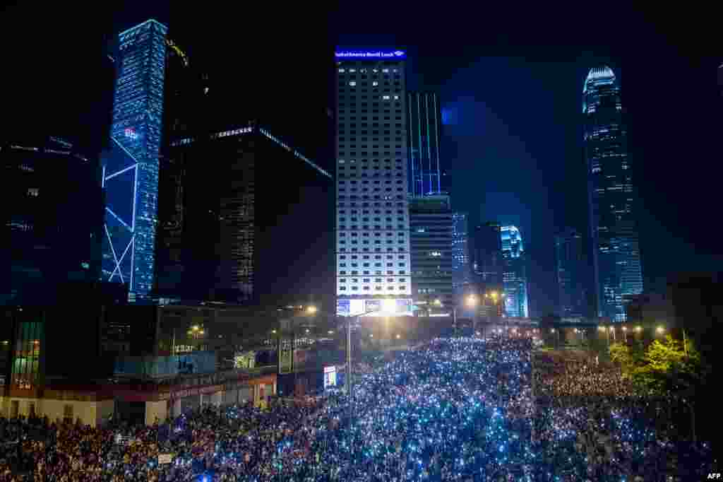 Pro-democracy demonstrators come together for the third night in Hong Kong to demand democratic elections after Beijing said it would allow elections for Hong Kong's&#39;s next leader in 2017 but would have to approve the candidates. 