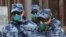 Members of Russia's National Guard wear respirators as the patrol a street during a subdued observance of the 75th anniversary of the Allied victory over Nazi Germany in World War II, amid the coronavirus pandemic, in Moscow, Russia, May 9, 2020. 