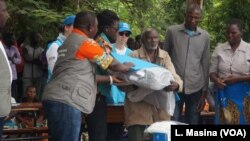 Elderly flood survivors receive assistance in the form of blankets, plastic mats, solar flashlights and other items, in Phalombe district, Malawi.