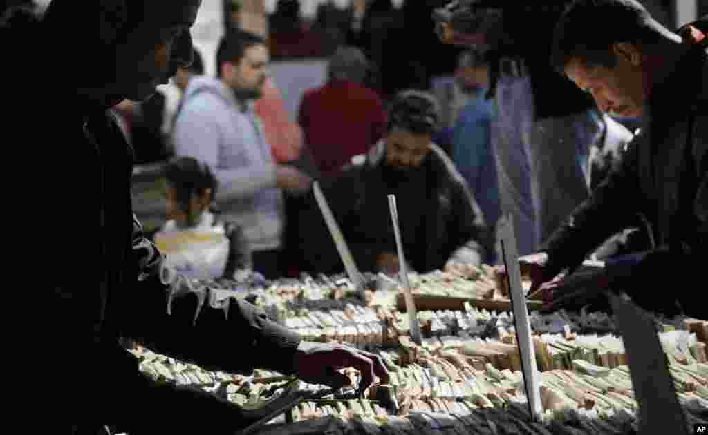 Egyptians browse secondhand books at the 47th annual Cairo International Book Fair.