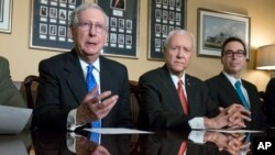 From left, Senate Majority Leader Mitch McConnell, R-Ky., Senate Finance Committee Chairman Orrin Hatch, R-Utah, and Treasury Secretary Steven Mnuchin speak to reporters as work gets underway on the Senate's version of the GOP tax reform bill, on Capitol Hill in Washington, Nov. 9, 2017.