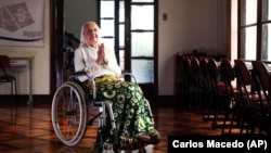 In this photo released by LongeviQuest, Sister Inah Canabarro, 115, puts her hands together in prayer, in Porto Alegre, Brazil, Friday, February 16, 2024. (Carlos Macedo/LongeviQuest, via AP)
