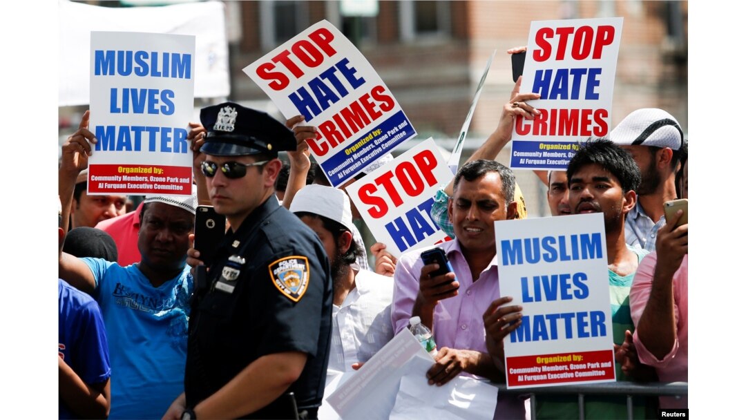 Community members take part in a protest to demand stop hate crime during the funeral service of Imam Maulama Akonjee, and Thara Uddin in the Queens borough of New York City, Aug. 15, 2016.