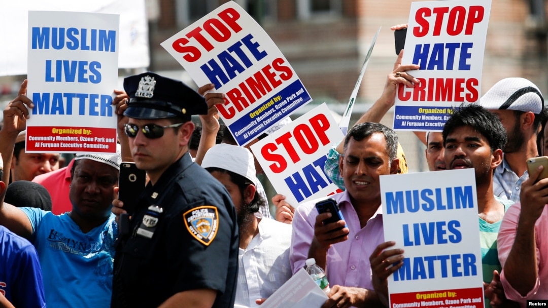 Community members take part in a protest to demand stop hate crime during the funeral service of Imam Maulama Akonjee, and Thara Uddin in the Queens borough of New York City, Aug. 15, 2016. 