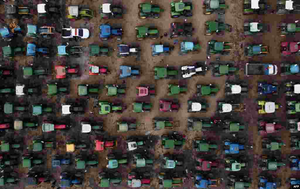 This aerial photo shows farmers&#39; tractors gathered during a demonstration to demand fairer prices for their produce, in Antequera, Spain.