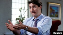 Canada's Prime Minister Justin Trudeau speaks with Reuters in La Malbaie, Quebec, Canada, May 24, 2018. 
