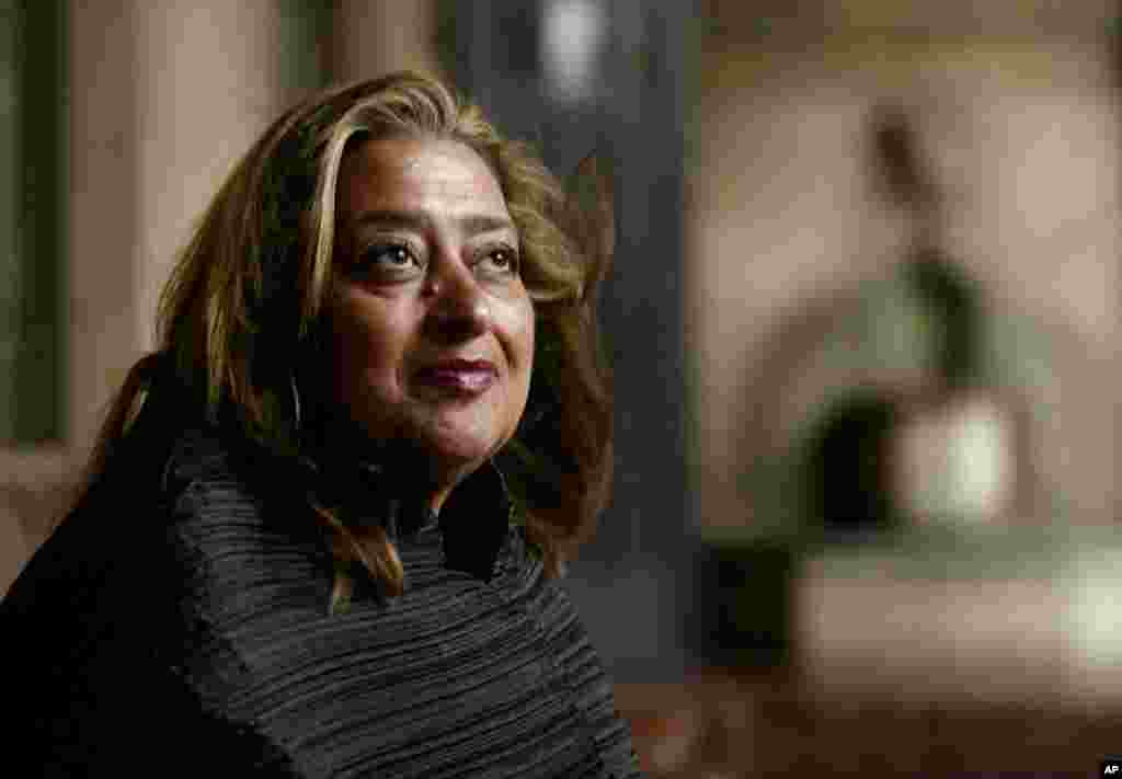 FILE- Iraqi-British architect Zaha Hadid poses in West Hollywood, California, March 21, 2004. Hadid, whose modernist, futuristic designs include the swooping aquatic center for the 2012 London Olympics, died at age of 65, Thursday, March 31, 2016.