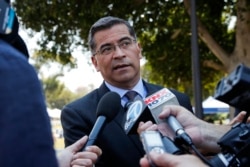 FILE - California Attorney General Xavier Becerra talks to reporters after a news conference at University of California, Los Angeles, Aug. 2, 2018.