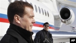 Russian President Dmitry Medvedev, left, February. 22, 2011