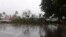 FILE - A tree blocks a road after it was blown down by the encroaching cyclone Winston in Nakasi, Fiji, Feb. 20, 2016. 