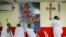 FILE -  Eritrean Christian Orthodox migrants attend a mass at a makeshift church in Tel Aviv, Israel, May 7, 2016.  