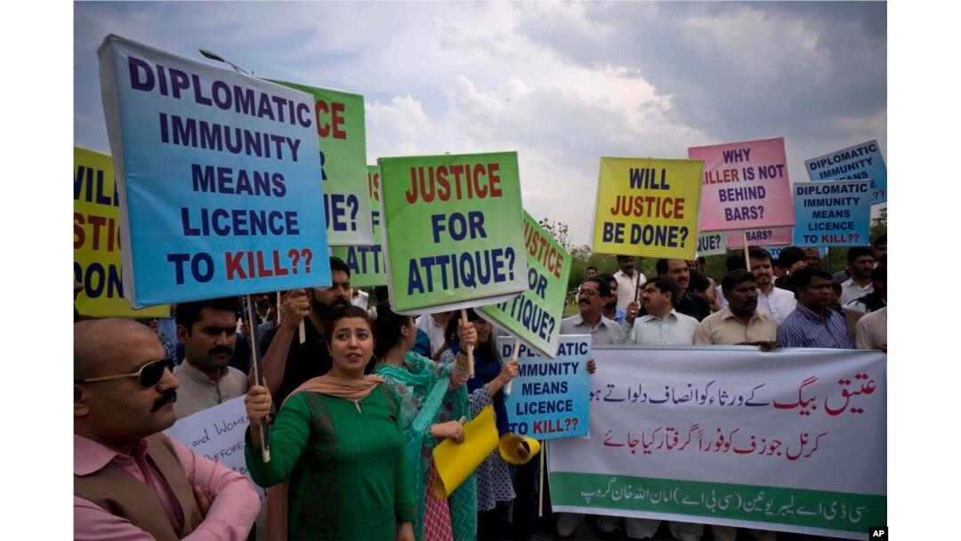 FILE - Pakistani protesters stage a rally demanding a trial for the American diplomat involved in a vehicle crash that killed one person, in Islamabad, Pakistan, April 10, 2018.