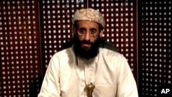 Anwar al Awlaki, a US-born cleric linked to al-Qaida's Yemen-based wing, gives a religious lecture in an unknown location in this still image taken from video released by Intelwire.com on September 30, 2011.