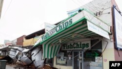 A row of shops is seen after sustaining damage in the Perth suburb of Bedford, Australia, May 25, 2020, after the area was lashed by gale force winds and a tidal surge.