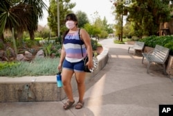 Arizona State University political science major Betzabel Ayala poses for a photo on campus Tuesday, Sept. 8, 2020, in Tempe, Ariz. Because of the coronavirus, Ayala is one of hundreds of thousands of off-campus U.S. college students who are being counted