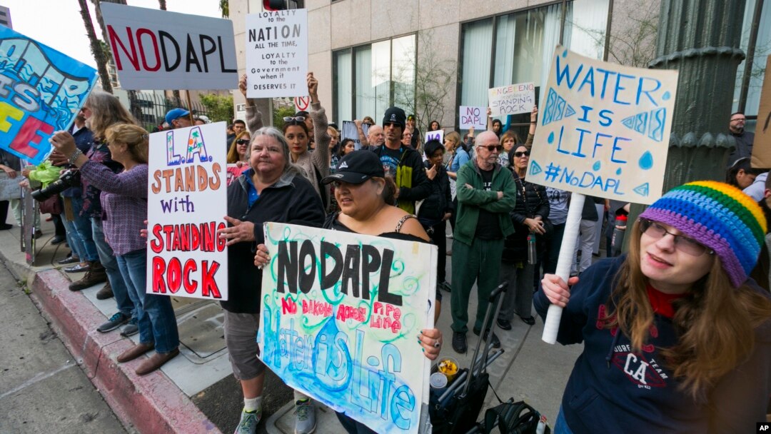 Opponents of the Dakota Access pipeline join protestors around the country, in response to the Army Corps of Engineers saying it will clear the way for completion of the disputed $3.8 billion project to carry North Dakota oil to Illinois, outside the Army