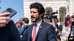 FILE - U.S. Representative Greg Casar, left, speaks in Washington, May 25, 2023. He is one of more than 60 members of Congress urging President Joe Biden to secure the release of people being held in Pakistan, including former Prime Minister Imran Khan.