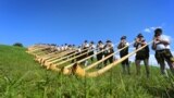 A cross made with ladders and firefighter helmets is placed inside a tent during a Mass celebrated by Bishop Giovanni D&#39;Ercole, in Arquata Del Tronto, near Amatrice, central Italy. The tent was set up as a temporary shelter for the earthquake survivors.