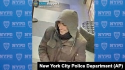 This image provided by the New York City Police Department shows a man wanted for questioning in connection to the investigation of the killing of UnitedHealthcare CEO Brian Thompson outside a Manhattan hotel, Dec. 4, 2024.