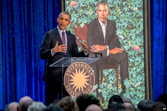 Former President Barack Obama, speaks at the unveiling ceremony for the Obama's official portraits at the Smithsonian's National Portrait Gallery, February 12, 2018, in Washington. (AP Photo/Andrew Harnik)