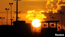 Sun rises over U.S. detention center Camp Delta at Guantanamo Bay Naval Base, Cuba, Oct. 18, 2012.