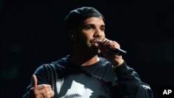 FILE - This Sept. 21, 2013 file photo shows Drake performing at the iHeartRadio Music Festival in Las Vegas. 