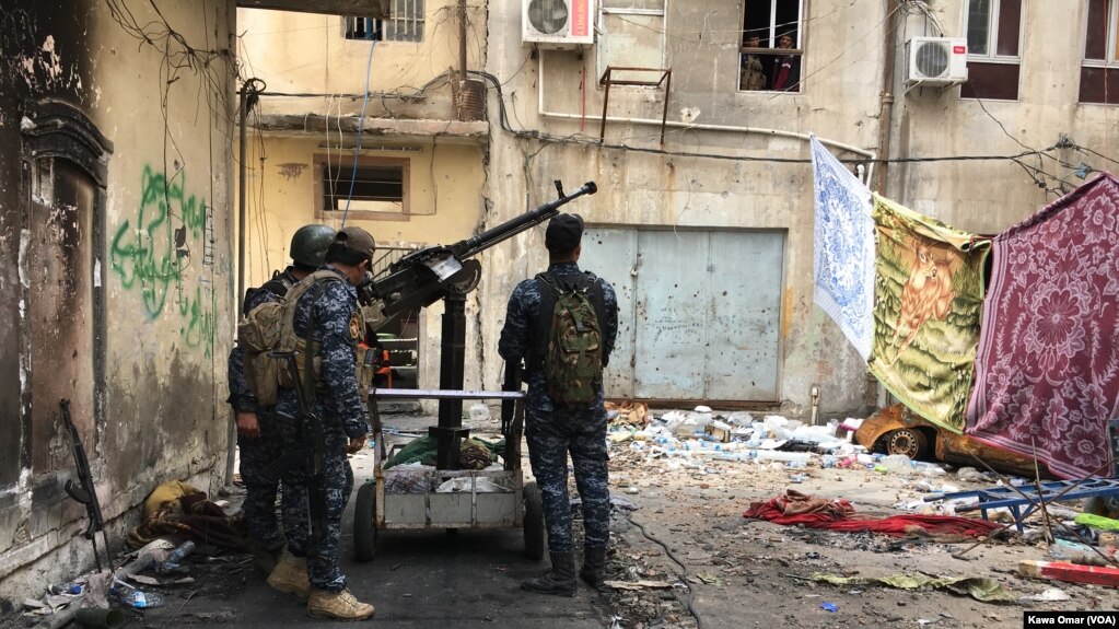 FILE - Iraqi forces are seen in Bab Jadid neighborhood, Mosul, Iraq, April 3, 2017. Islamic State militants reportedy shelled Iraqi forces with chemical weapons agents in the Urouba and Bab Jadid districts on April 15.