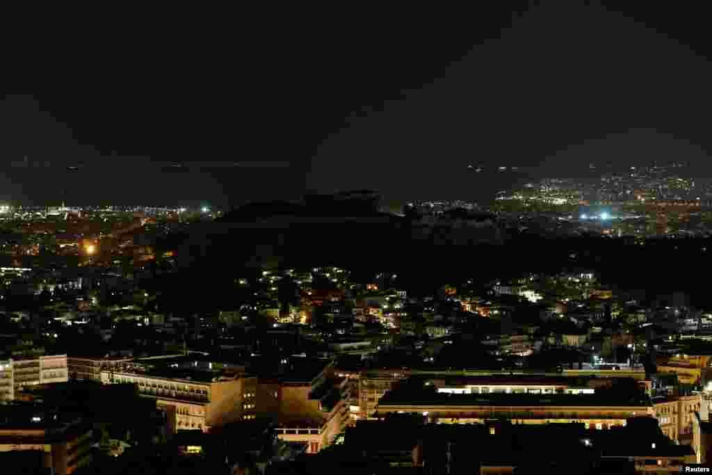 The ancient Parthenon temple is pictured atop the Acropolis hill during Earth Hour in Athens, Greece, March 30, 2019.