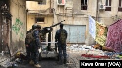 FILE - Iraqi forces are seen in Bab Jadid neighborhood, Mosul, Iraq, April 3, 2017. Islamic State militants reportedy shelled Iraqi forces with chemical weapons agents in the Urouba and Bab Jadid districts on April 15.