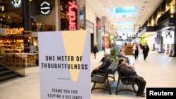 A sign promoting social distancing is pictured in the Gallerian shopping center, as the spread of the coronavirus disease continues, in Stockholm, Sweden, May 12, 2020. 
