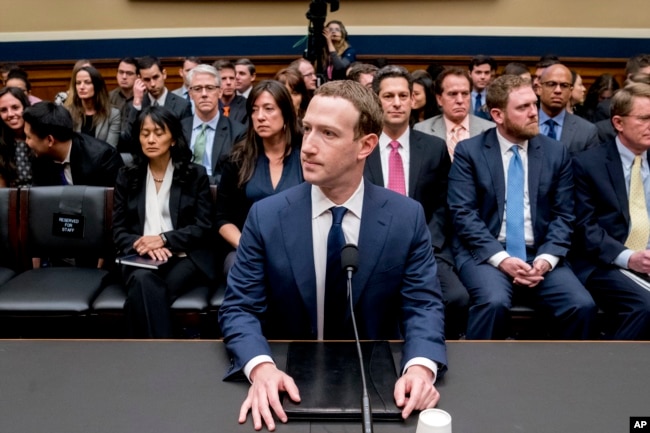 FILE - Facebook CEO Mark Zuckerberg arrives to testify before a House Energy and Commerce hearing on Capitol Hill in Washington, Wednesday, April 11, 2018. (AP Photo/Andrew Harnik)