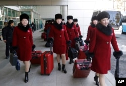 North Korean cheering squads arrive at the Korean-transit office near the Demilitarized Zone in Paju, South Korea, Feb. 7, 2018