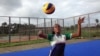 Florence Amara in action on the volleyball court, Freetown, Sierra Leone, July 22, 2015. (N. deVries/VOA News)